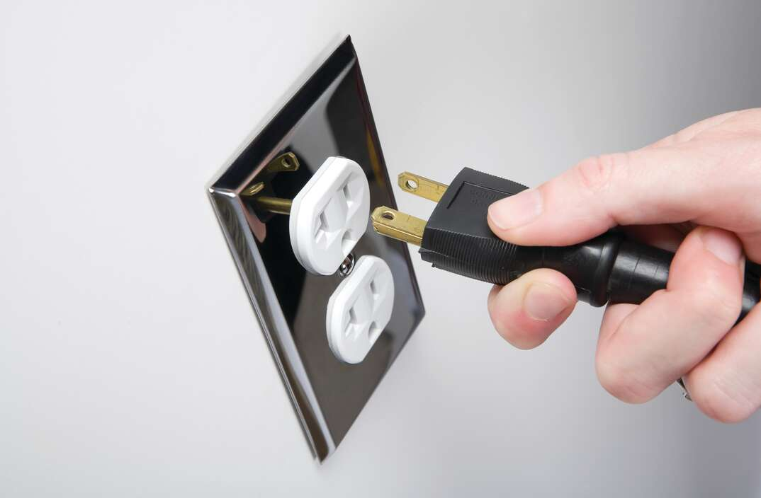 Plug cable into power outlet.png